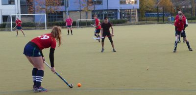Women playing hockey