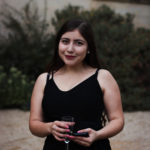 student at a formal in Front Quad smiling