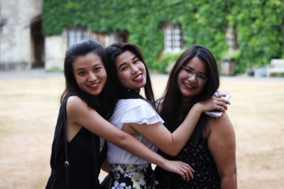 students smiling in Exeter College Front Quad